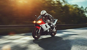 A person riding a motorcycle on a road